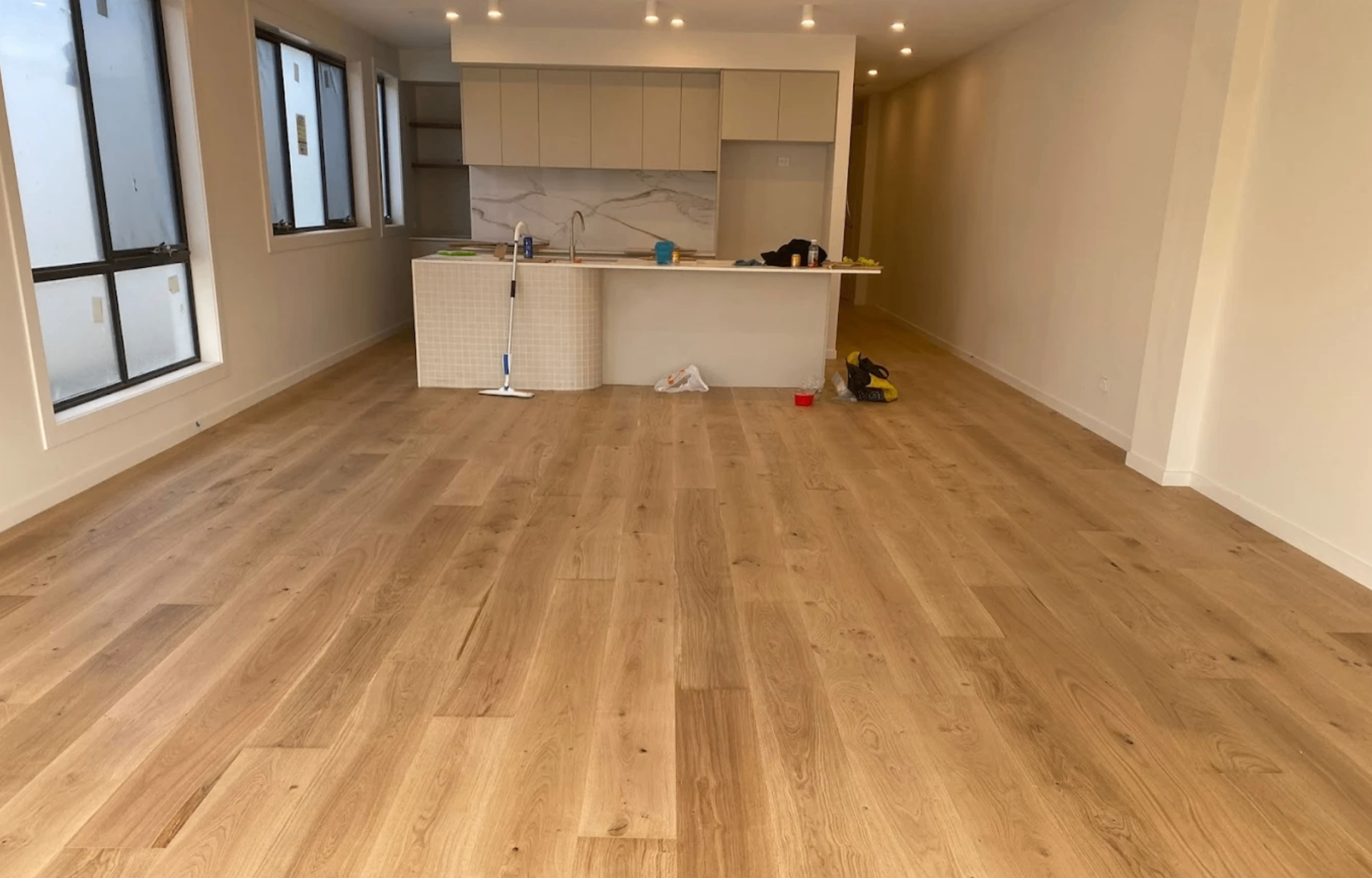 Four hybrid timber flooring colours from the LVJ range shown side by side in cafe interiors