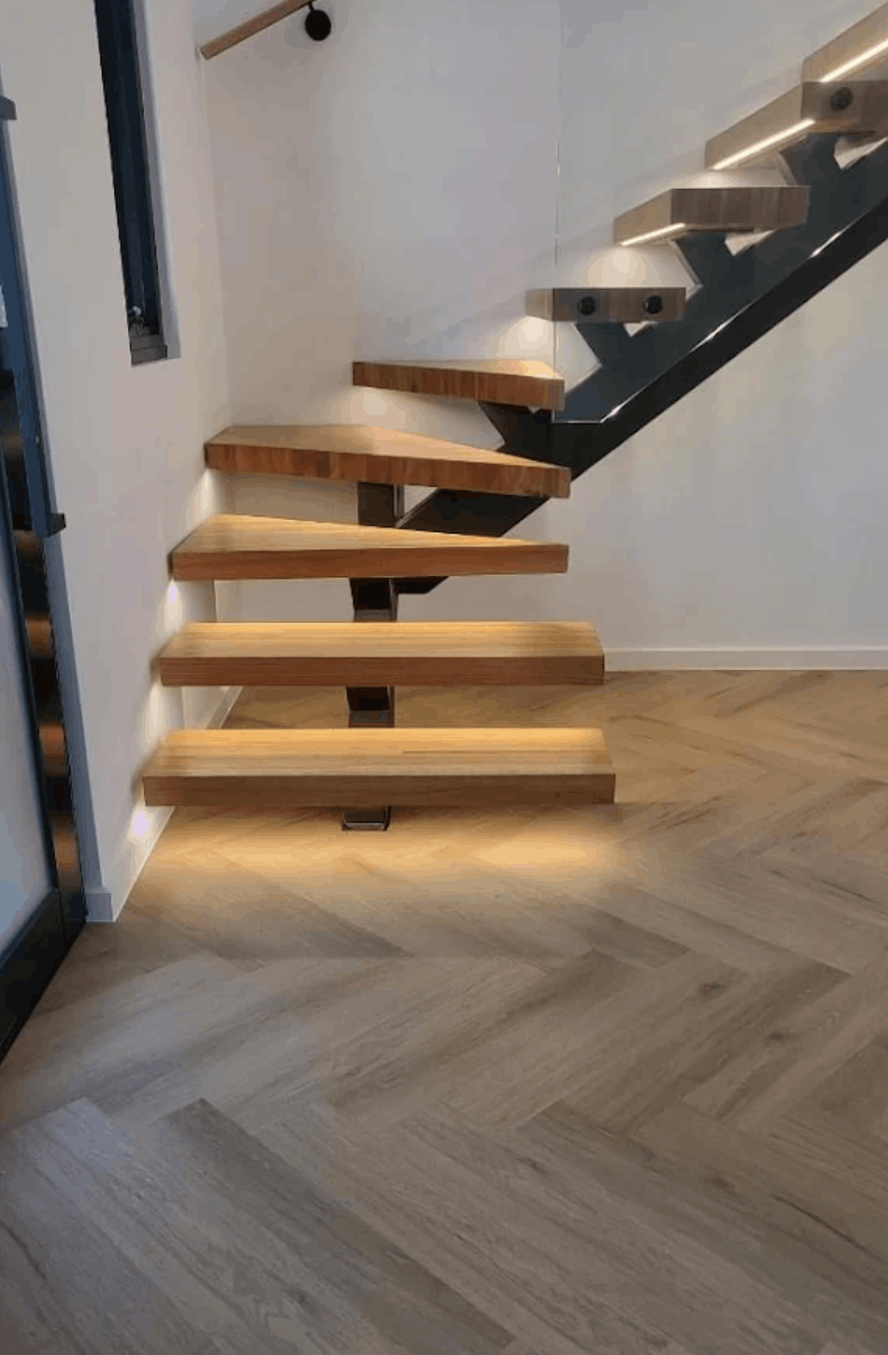 Floating timber staircase finished with hybrid herringbone flooring by LVJ Timber Floor Melbourne