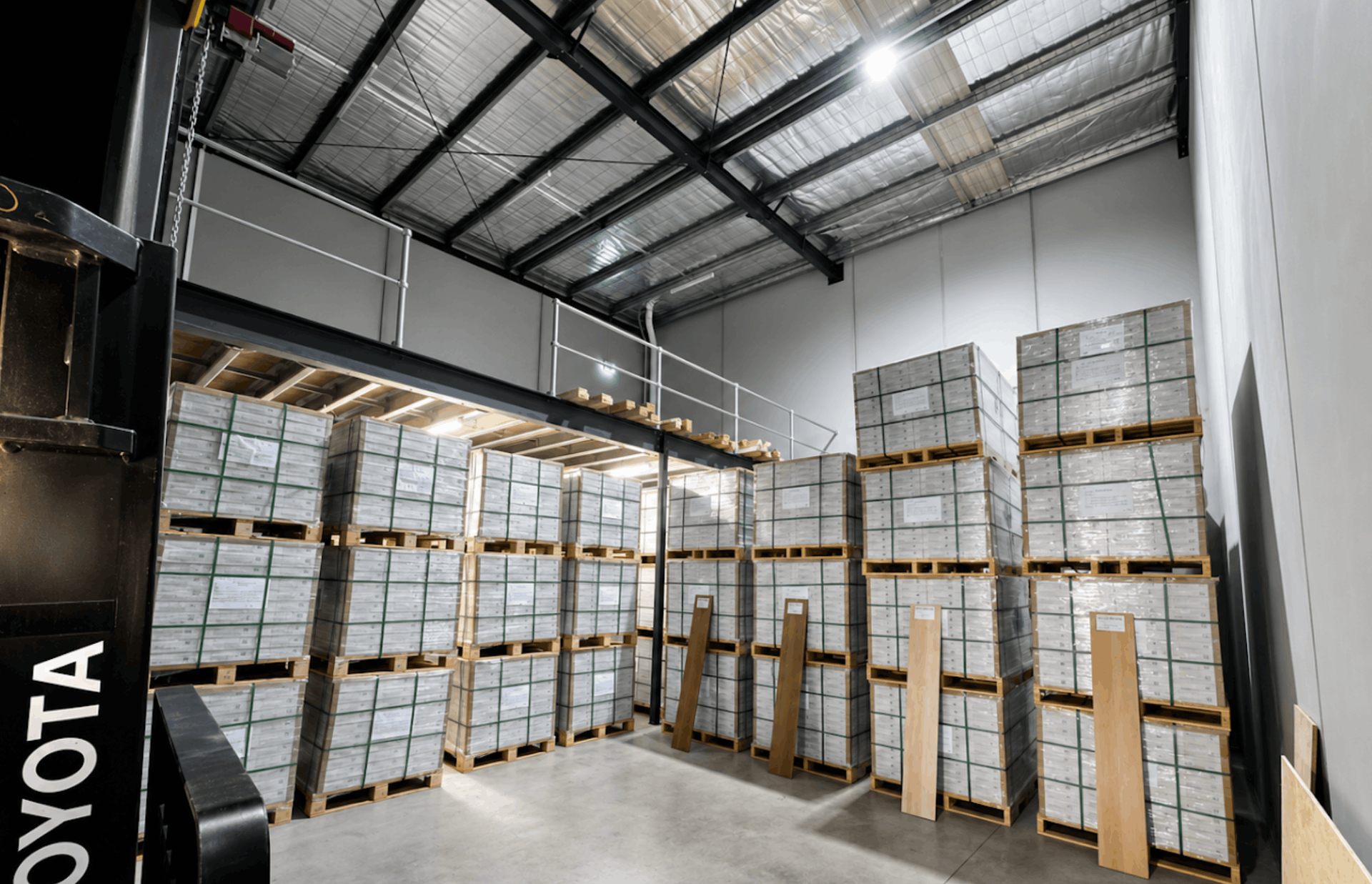 LVJ Timber Floor warehouse in Braybrook stacked with hybrid flooring pallets ready for Melbourne projects